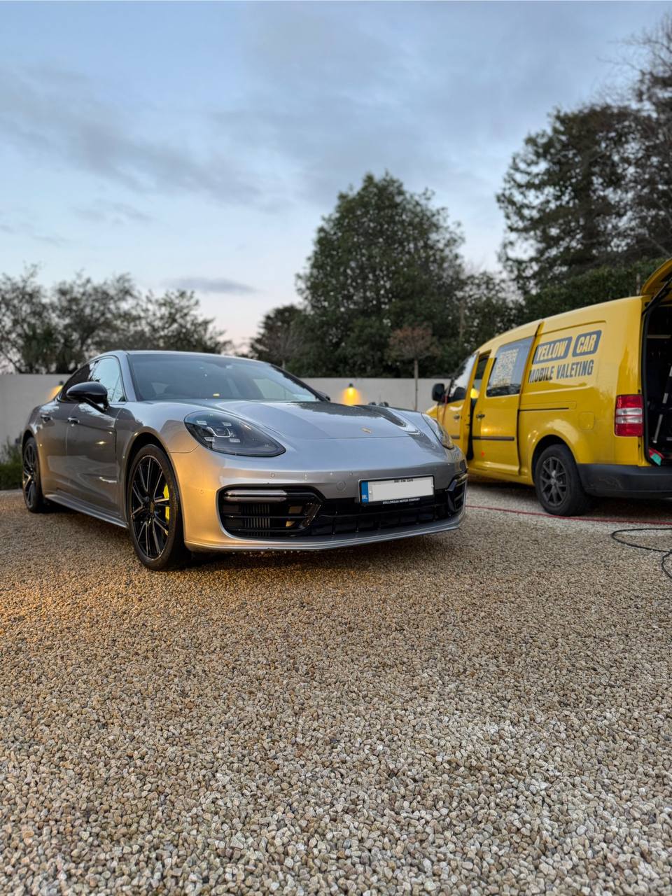 Porsche with YellowCar van
